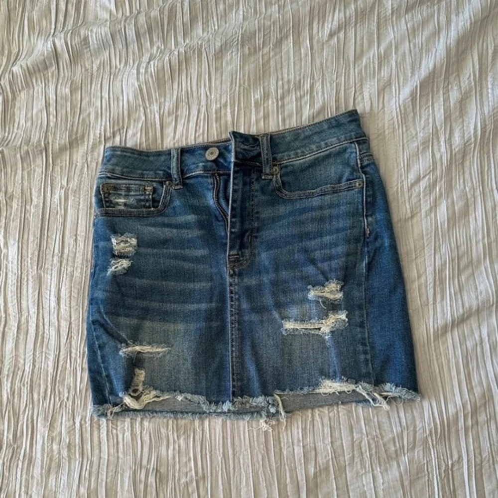 American Eagle blue denim distressed mini skirt